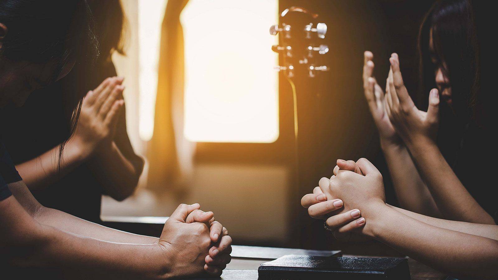 Multiple hands being shown in different forms of worship