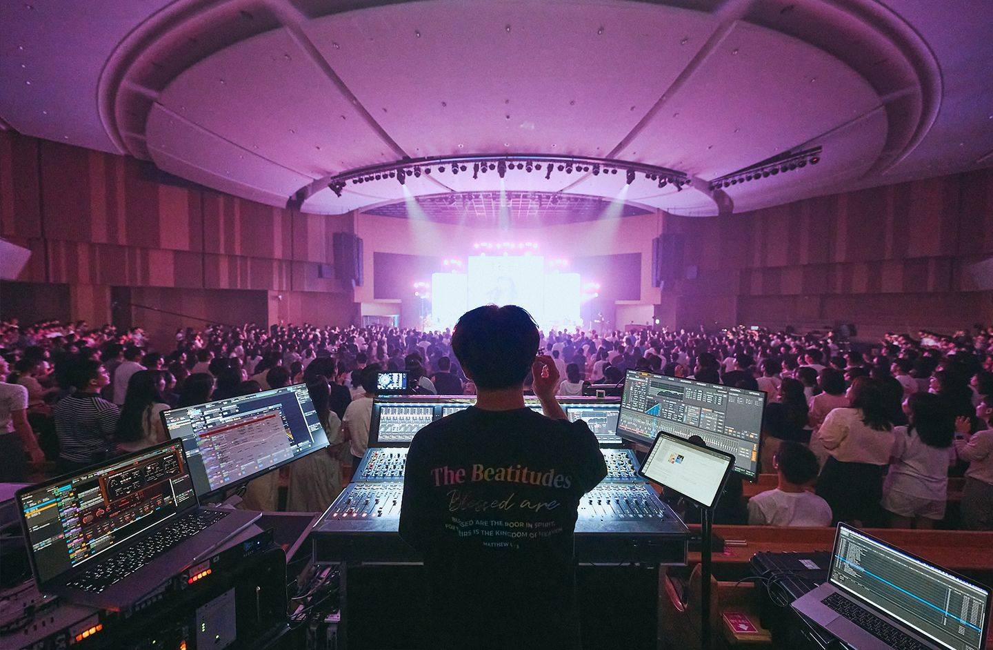 Picture of a sound engineer at a large Korean worship gathering