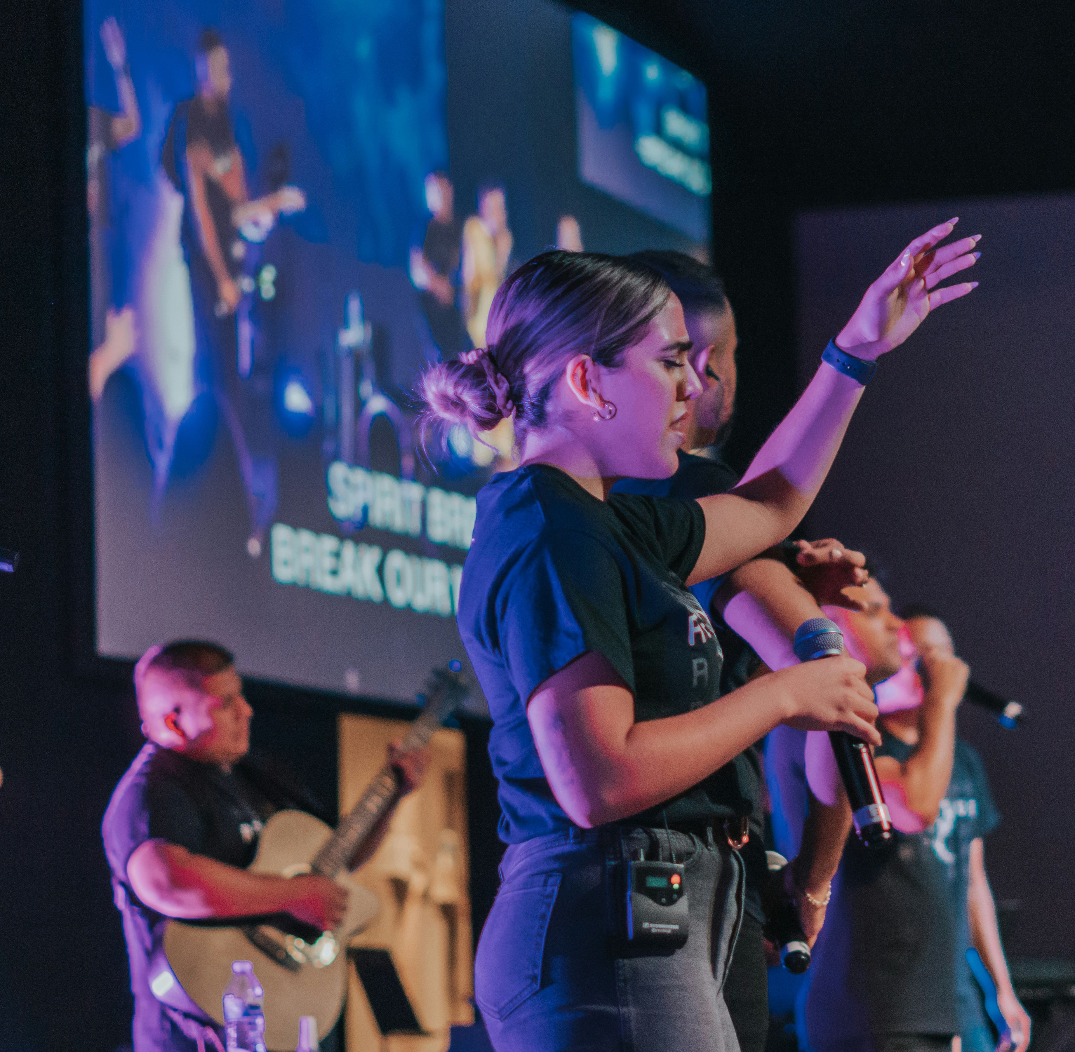 A worship team leading on a church stage.